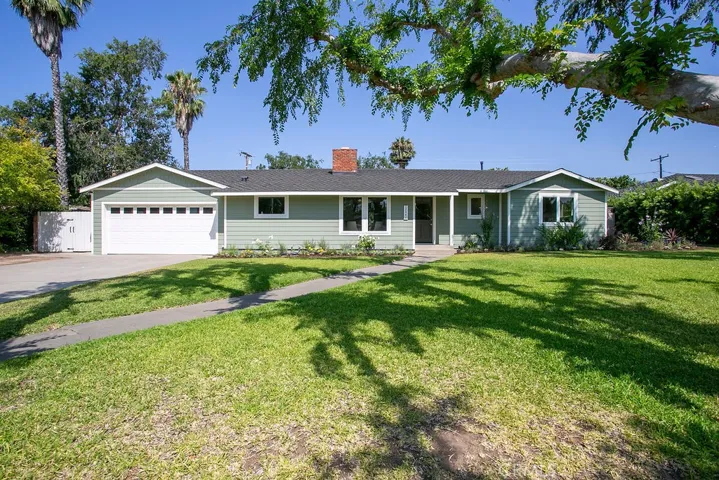 The gracious front yard is set back from the street and has room for RV storage