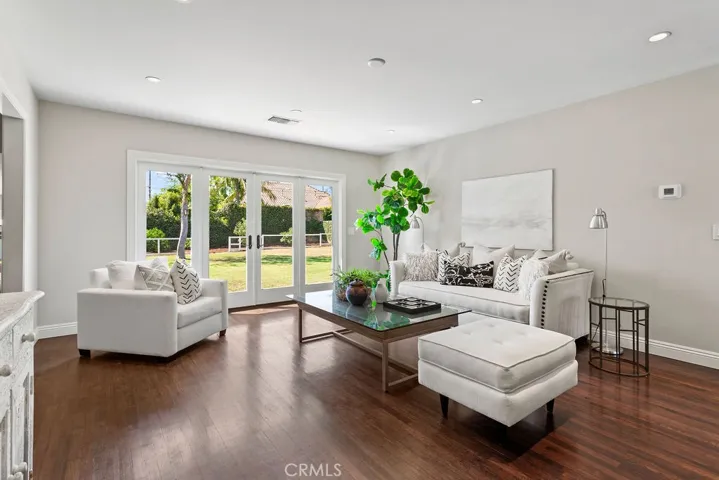 Bright light streams through the french doors to the backyard from the living room...