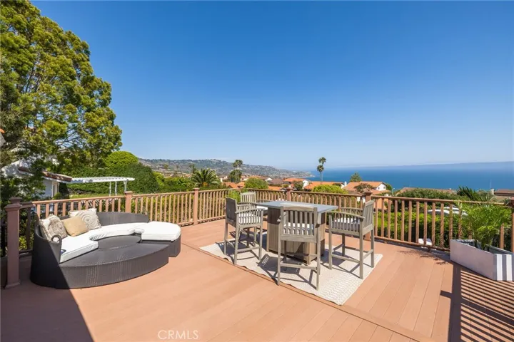 Private Spanish-tiled stairs lead down to the patio, enhancing the sense of exclusivity.