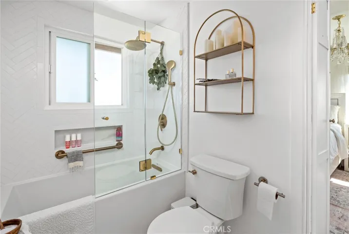 Beautifully remodeled Jack & Jill bath with stunning herringbone tile and a spa-like ambiance.