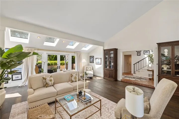 The formal living room overlooking and opens to the courtyard with French Doors.