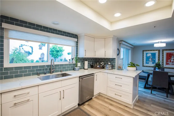 Upgraded kitchen, dining area and slider to beautiful yard.