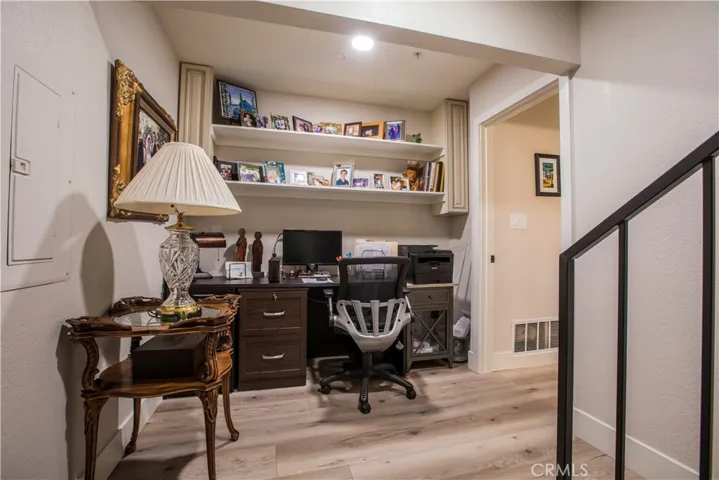 Just off the garage is a work area that leads to the large laundry room with sink, counter and storeage space.