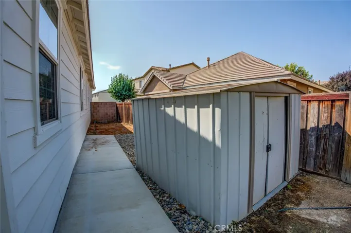 The other side of the house offers room for a storage shed.
