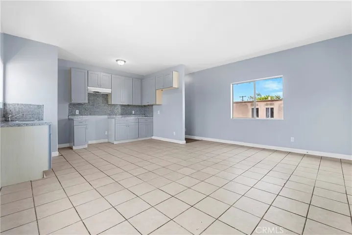 Upper Kitchen has New Cabinets, Backsplash, Faucet, and Lighting