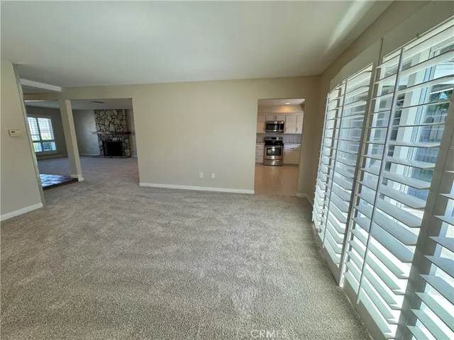 There is a sliding door in the Family Room leading to the backyard with high-end plantation shutters for privacy.