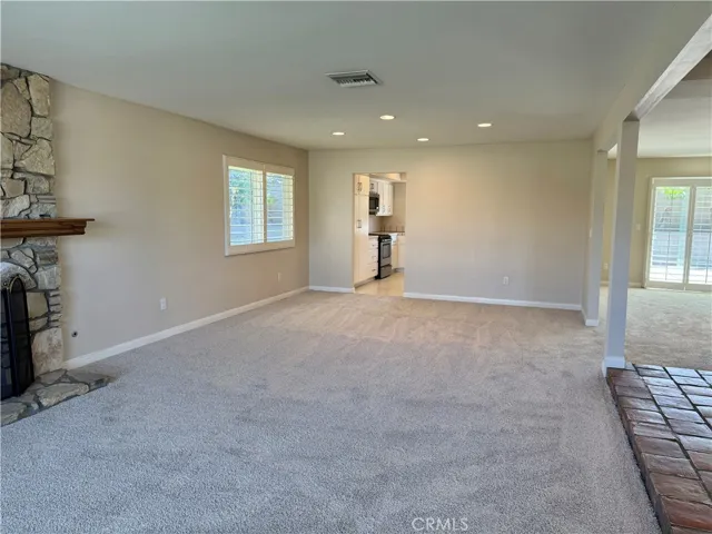 The living room/dining room is open to the family room, the kitchen in the center.