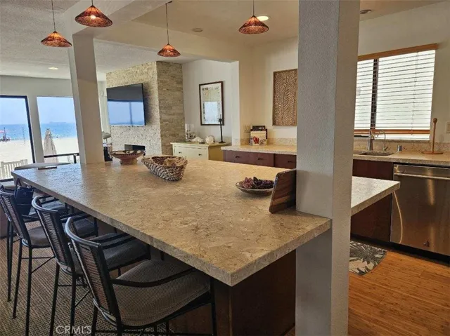 Large Custom Designed Island with Syrian "Shell Beach" Marble - Wonderful layout Open to Living, Dining, Private Patio and Ocean Views (sand too!). Enjoy this expansive Island with friends, watch a sporting event and cook/entertain at the same time in this great kitchen.