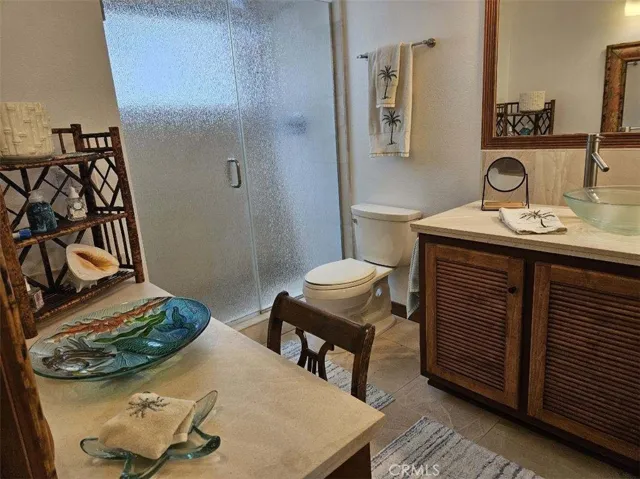 Primary En Suite Bathroom with custom counter top and Vanity area.
