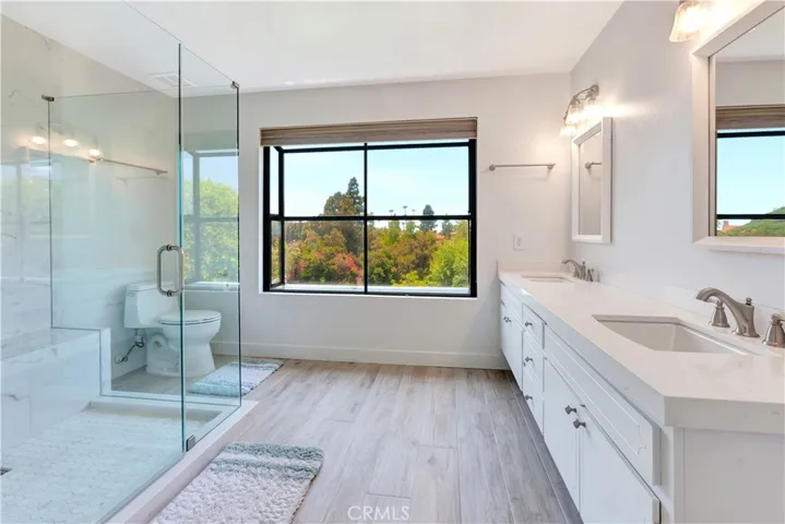 Remodeled Primary Bath with Shower Stall and Dual-Sink Vanity