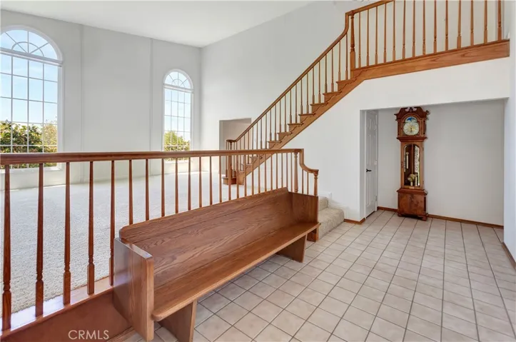 Shot from Formal Entry Looking at Living Room with Dramatic 2-Story Windows