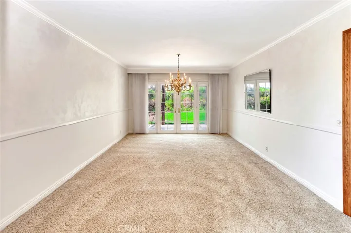 Formal Dining Room with French Doors to Rear Yard will Accommodate Virtually Any Dining Set