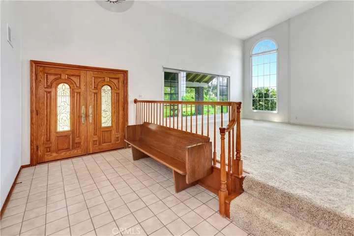 Double-Door Entry also Showing High LR Ceilings and Decorative Windows