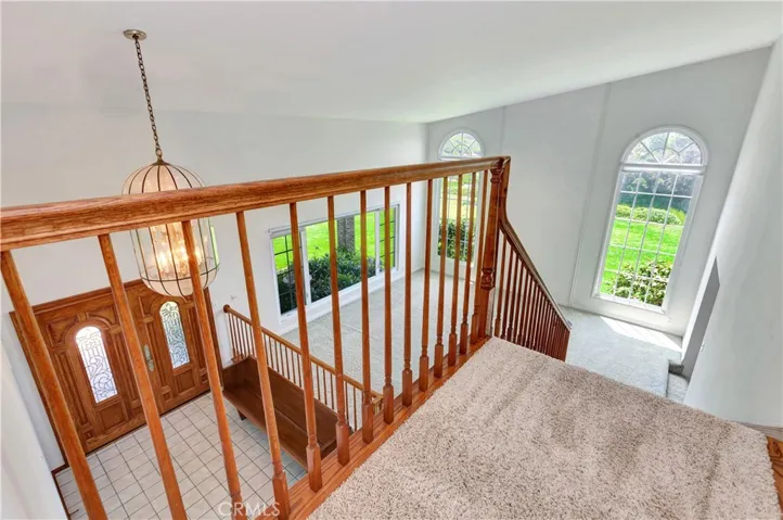 Overlooking Entry & Living Room Showing Decorative 2-Story Windows