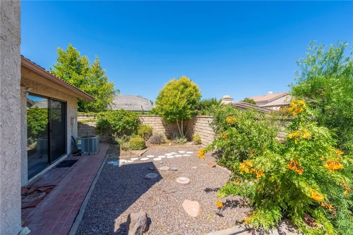 Landscaped Yard off of Living Room and Primary Suite