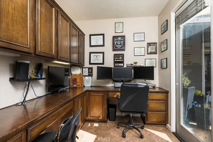 Office with French doors that lead to courtyard
