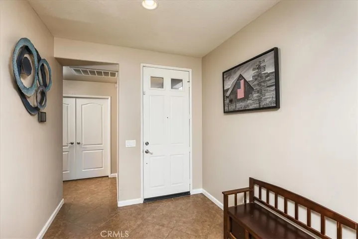 Entry and downstairs bedroom in background