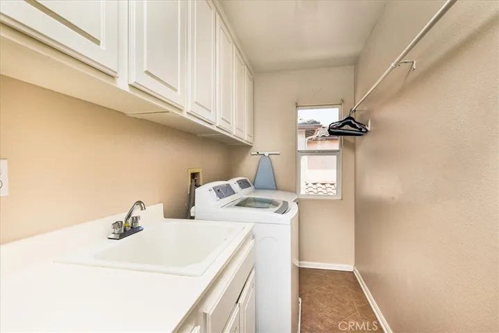 Laundry Room with sink and many cabinets - upstairs