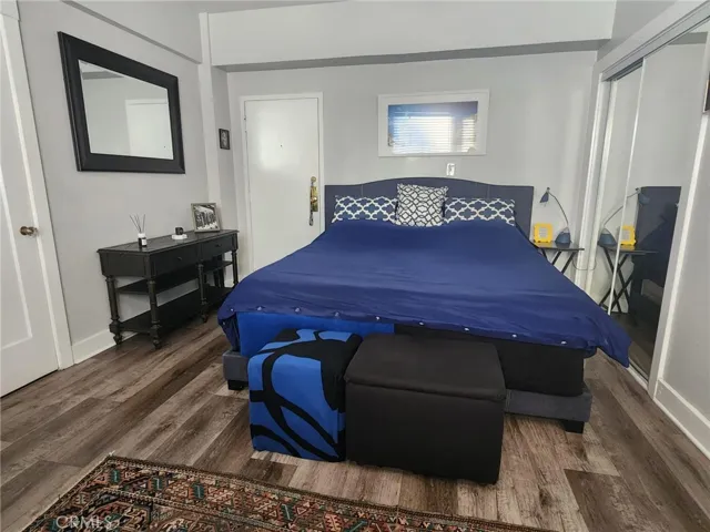 The king size bed has 2 closets. One is a large closet with sliding glass doors and...