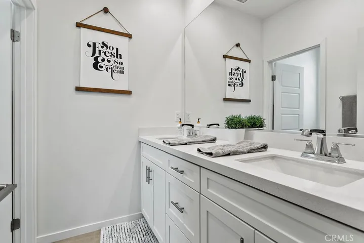 Guest bath with dual sinks & separate door entry to bath/toilet