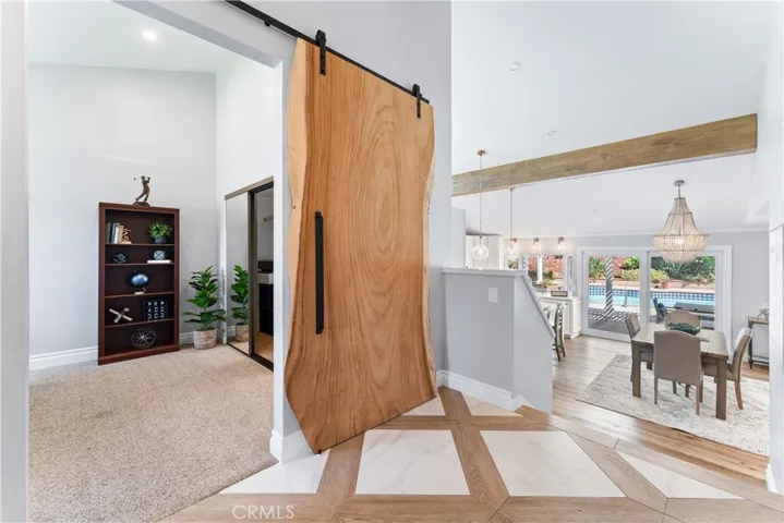 Office/Bedroom with natural wood barn door