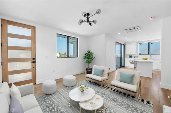 Open concept living area, Light and bright with high ceilings Photo has been virtually staged