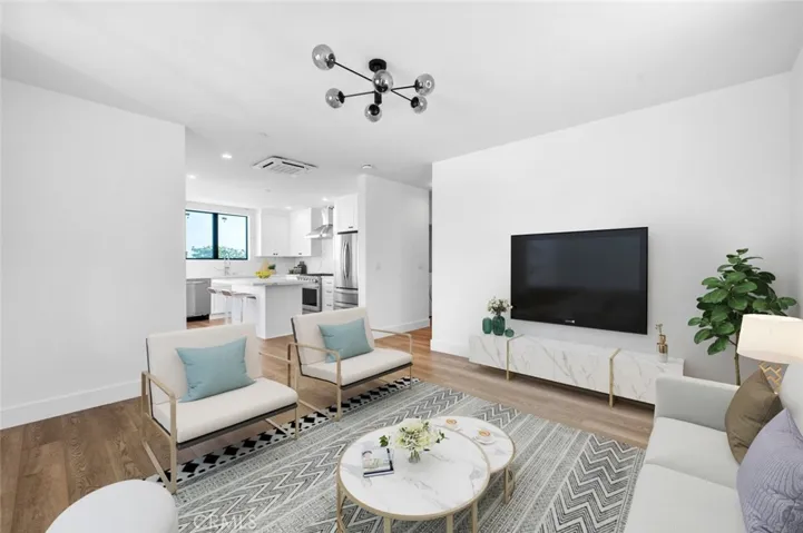Open concept living area, Light and bright with high ceilings Photo has been virtually staged