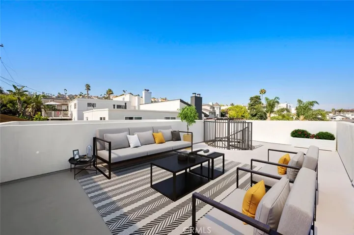 Roof Top Deck with expansive panoramic White Water Ocean View Photo has been virtually staged