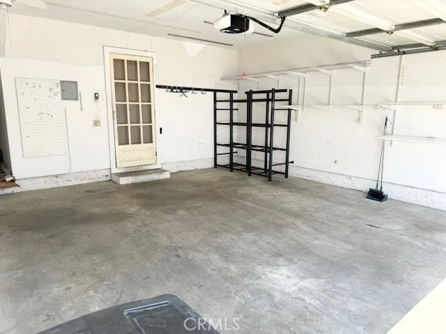 2-Car Direct Access Garage with Auto-Opener & Shelving for Storage!