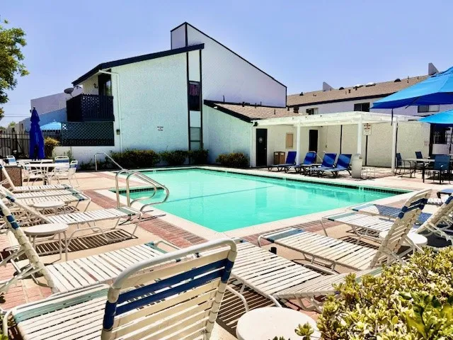 ...with jacuzzi, Bathrooms, & lots of Lounge Chirs, Tables & Umbrellas!