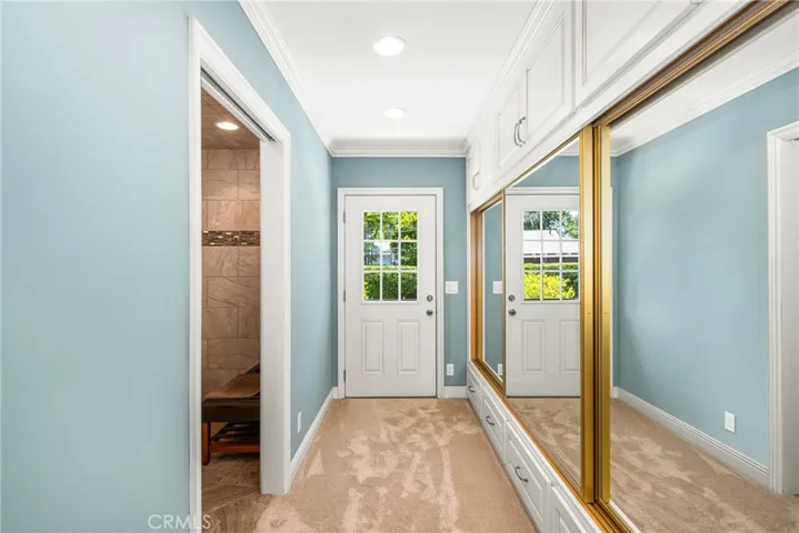 Door from Ramp into en-suite, mirrored closet doors.