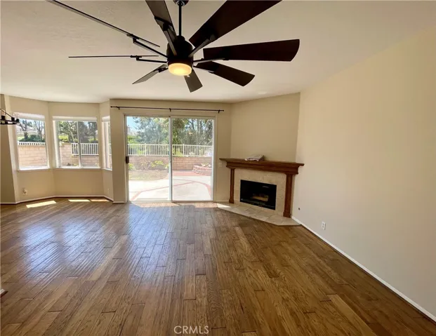 The family room with entrance to the back yard. Beautiful NEW fan!