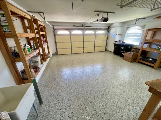 The garage has NEW epoxy flooring and extra storage.