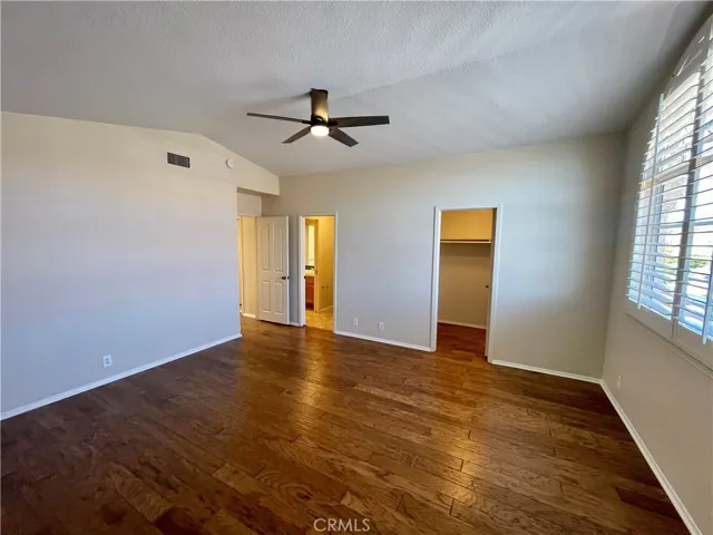 The front secondary bedroom is huge and includes a walk-in closet plus NEW ceiling fan!