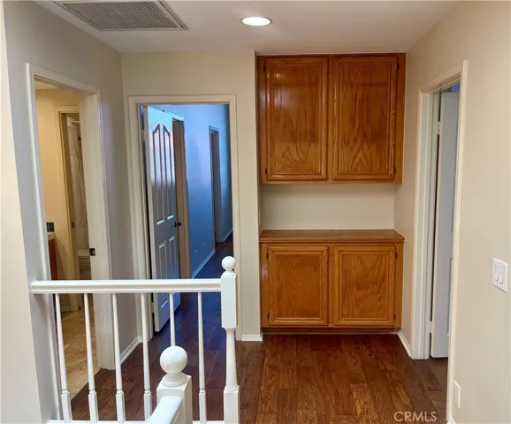 Upstairs landing with linen storage.