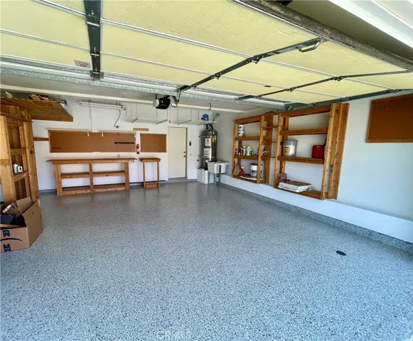 The garage has NEW epoxy flooring and extra storage.