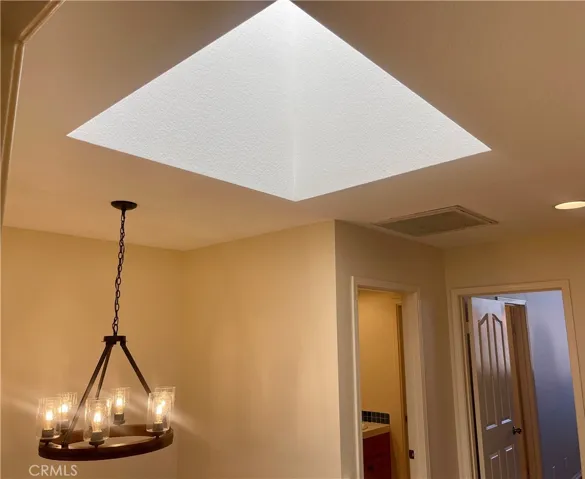 Upstairs landing with NEW light fixture and skylight!