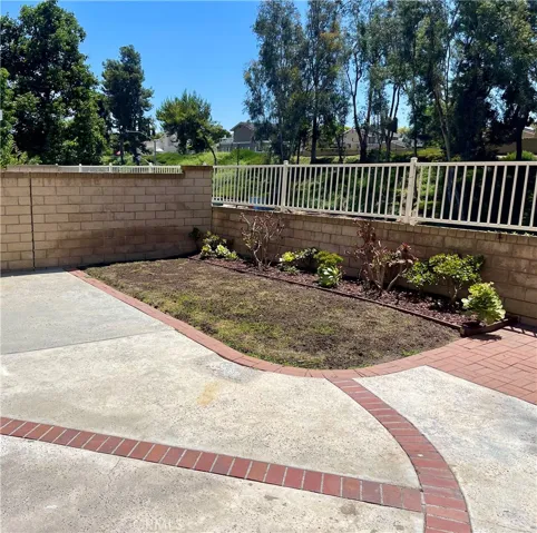 The back yard grassy area has just been reseeded and should be growing green shortly. The rest of the back yard is very low maintenance.