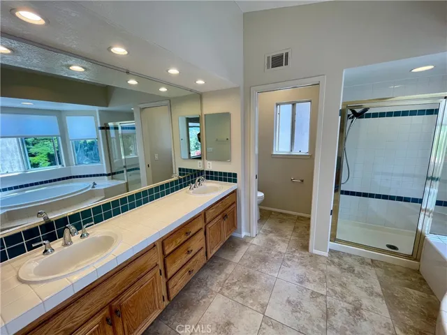 The master bathroom is VERY clean and features NEW sink faucets !