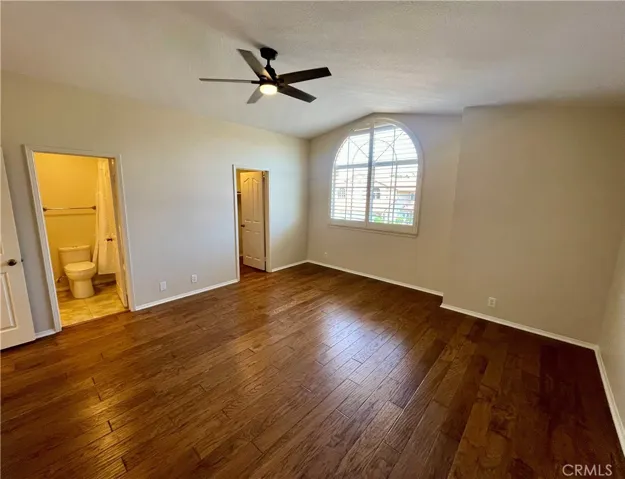 The front secondary bedroom is huge and includes a walk-in closet plus NEW ceiling fan!