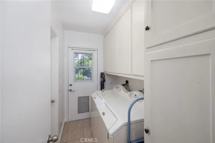 Laundry is just off the kitchen and there is a door that goes to the backyard.