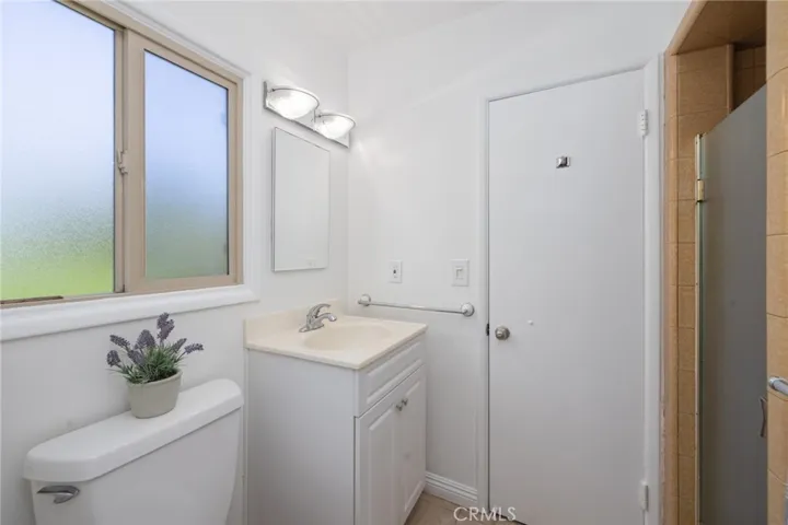 Back bathroom has a shower.