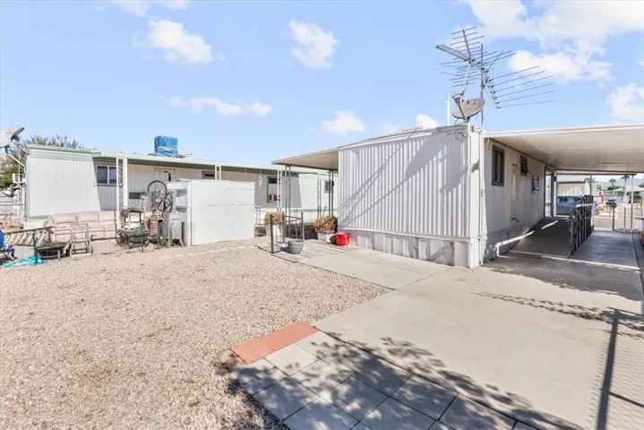 Back Yard & Ramp to Sliding Glass Door Entrance from Side of house.