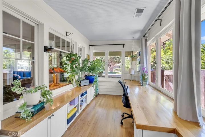 Sunroom/office is overflowing with natural crisp light.