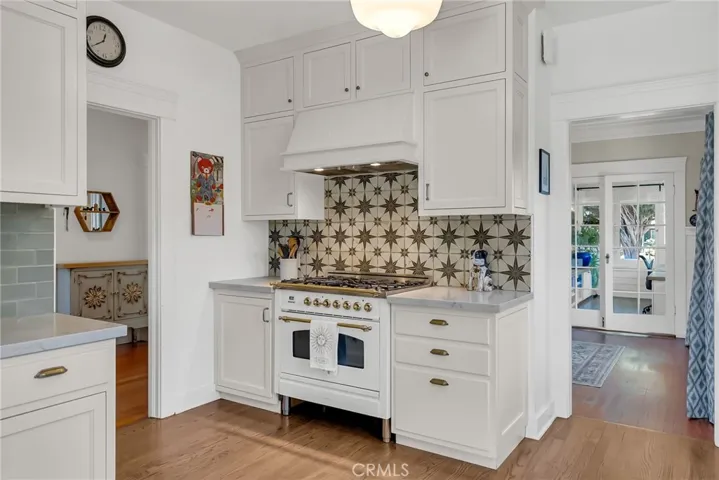 Remodeled kitchen with Hallman stove, built in Italy by Bertazzonni. Chef-grade power with burners, convection electric oven, and gorgeous backsplash!