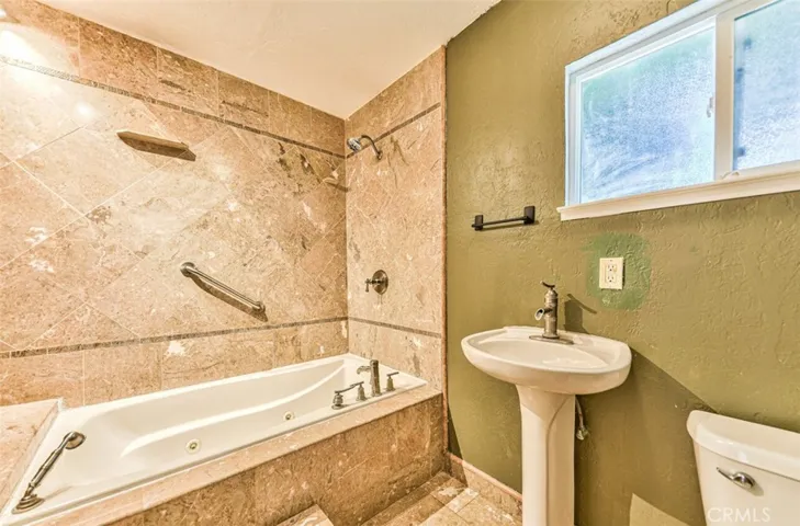 Hallway bathroom with jetted tub & shower