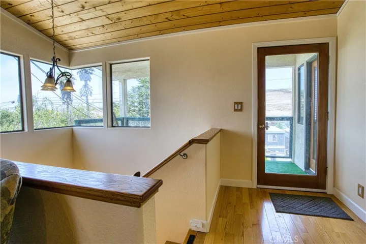 Stairway and entry to frontage covered balcony.