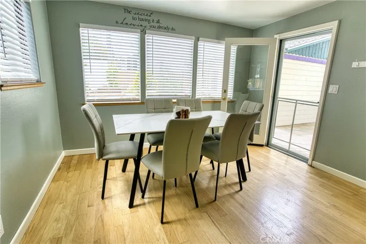 Dining space with view of landscaped back yard.