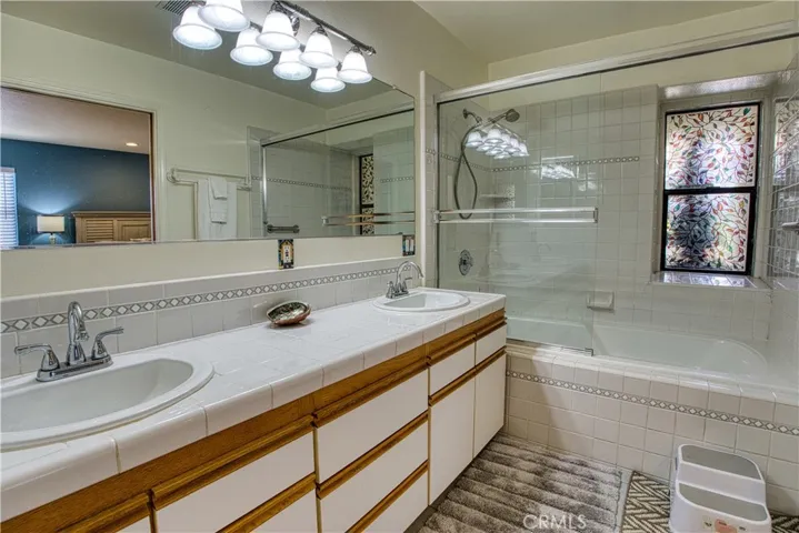 Master suite vanity with tub and shower.