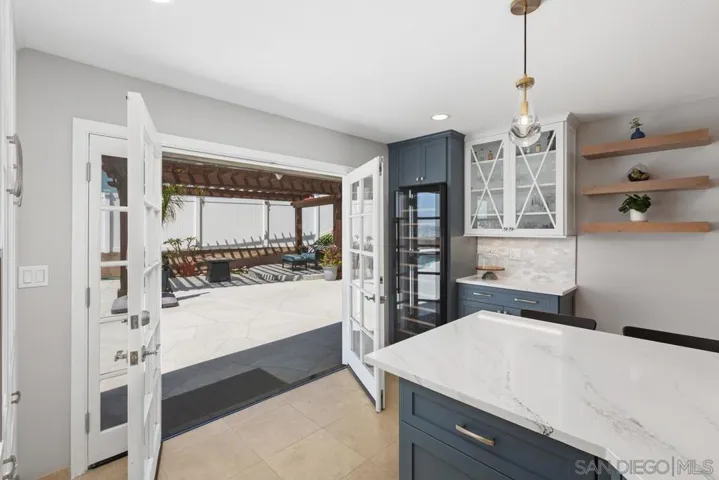 Grab a bottle of wine out of the wine cooler on your way out of the kitchen and into the pool and pergala